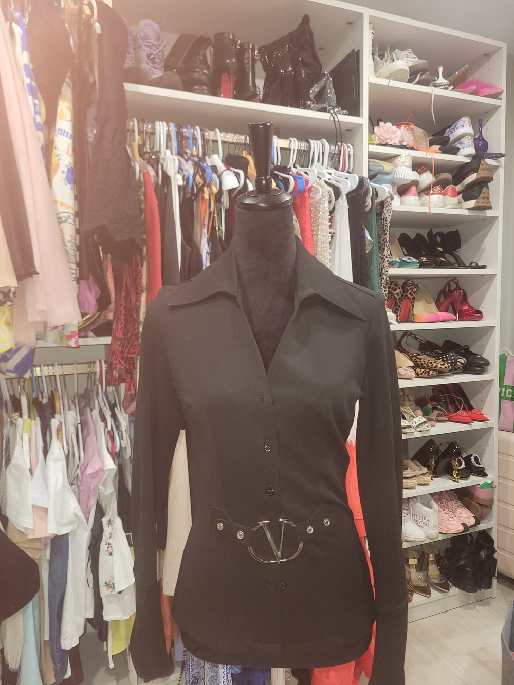 Black Button-Front Long Sleeve Top with Decorative Waist Hardware.VERTIGO Paris